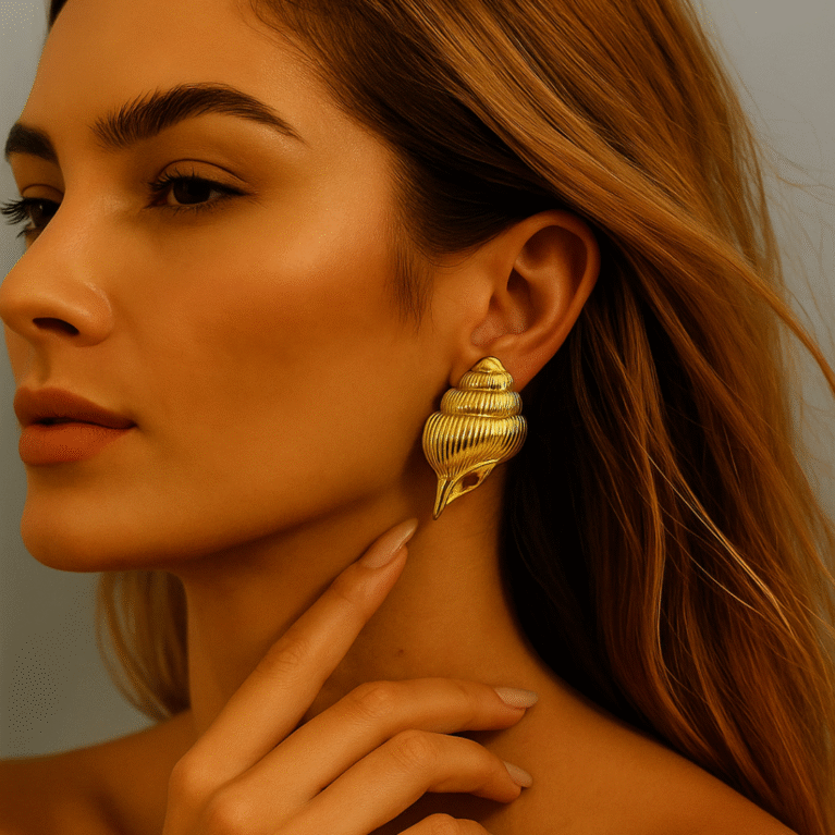 Golden Conch Statement Earrings by VIKTAMNA
