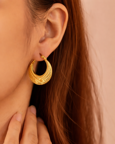Crescent hoop earrings by VIKTAMNA