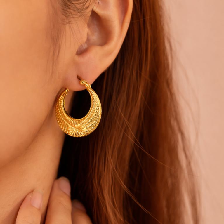 Crescent hoop earrings by VIKTAMNA